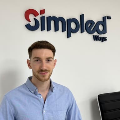 Robert L., founder of Simpled Services, in the company office